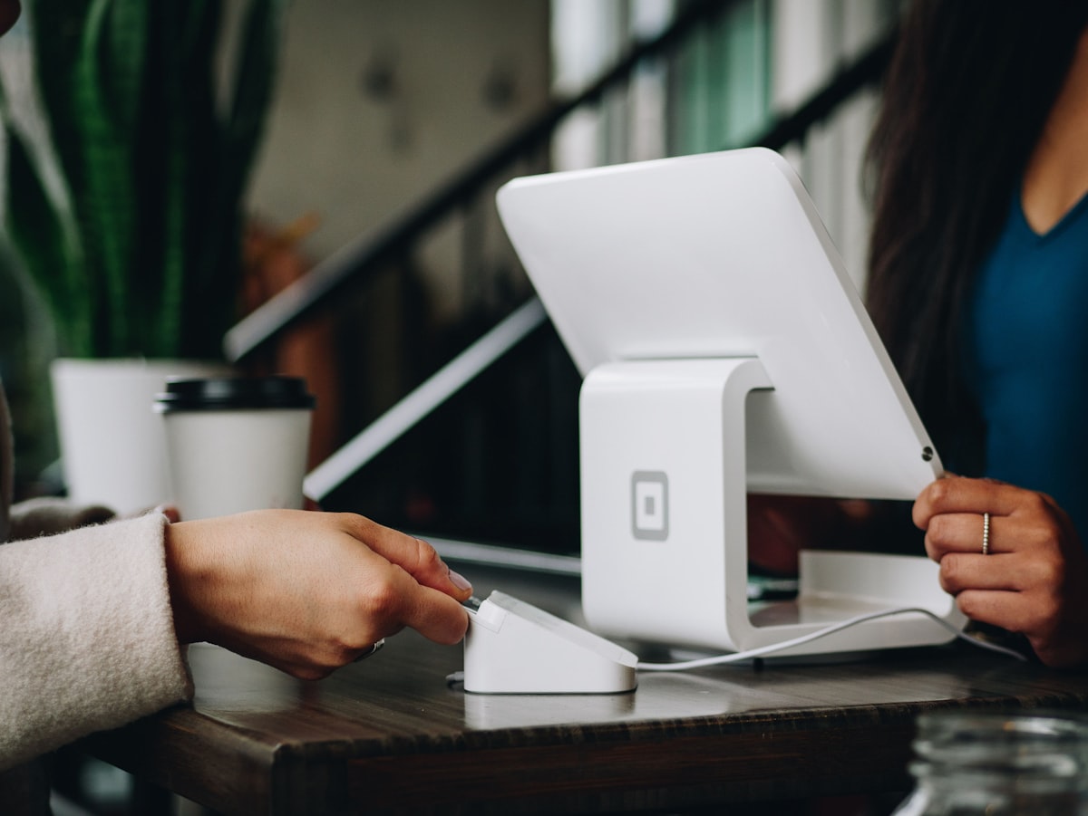 Business owner reviewing customer testimonials and conversion metrics