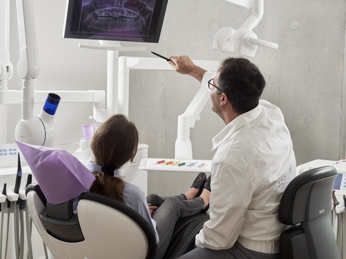 Patient reviewing dental practice website on a tablet
